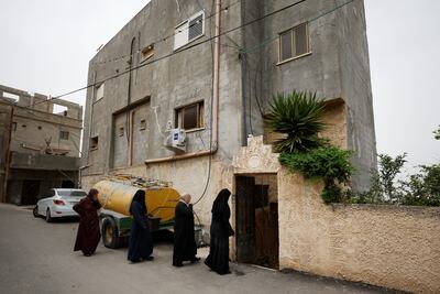 Mourners enter the family home Raed Hazem, a Palestinian from Jenin refugee camp who killed three Israelis after opening fire at a Tel Aviv bar on April 8, 2022. Reuters