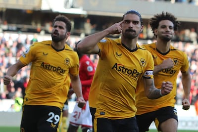 Ruben Neves celebrates his goal from the penalty spot. AFP