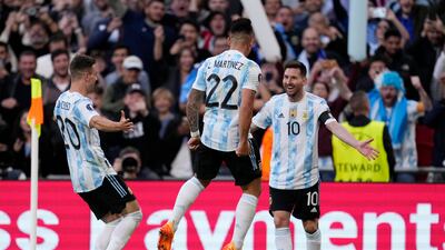 Argentina's Lautaro Martinez, centre, celebrates with his teammates Lionel Messi, right, and Giovani Lo Celso after scoring his side's opening goal in the Uefa Cup of Champions game against Italy at Wembley Stadium, London, in June 2022. AP
