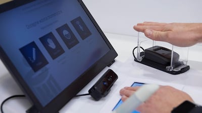 Palm-reading technology could be used for passport control, banking or scanning blood vessels, as above in Poland. EPA
