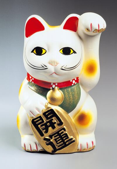Maneki neko, a Japanese talisman that brings good luck. Getty Images
