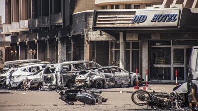 Damaged vehicles from two car bombs outside the Splendid Hotel in Ouagadougou, Burkina Faso, on January 16, 2016. Wouter Elsen/EPA