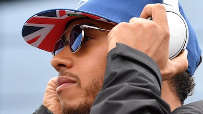 Mercedes driver Lewis Hamilton stands in the paddock ahead of the Formula One British Grand Prix at Silverstone motor racing circuit in Silverstone, central England, on July 10, 2016. Andrej Isakovic / AFP