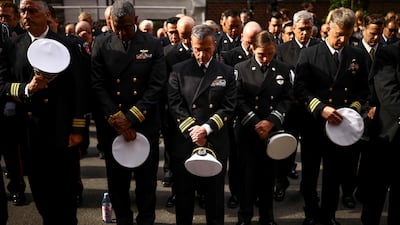 Firefighters pay tribute outside the Engine 54/Ladder 4/Battalion 9 firehouse in New York. AFP