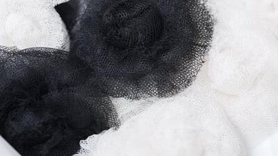 More than 120 seamstresses – including premières from the Chanel ateliers on the famed Rue Cambon – formed the backdrop to the runway show, and were seen surrounded by the tools of their traditionally secretive trade: sewing machines, mirrors, pins, fabrics, multicoloured threads, toiles and mannequins. Olivier Saillant