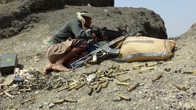 A fighter loyal to Yemen's government takes up position at the frontline of fighting against Houthi fighters in the southern province of Lahej. Stringer / Reuters