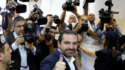 Lebanese Prime Minister and candidate for the parliamentary election Saad Hariri shows his ink-stained finger after casting his vote in Beirut, Lebanon, on May 6, 2018. Jamal Saidi / Reuters