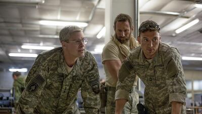 Brad Pitt, left, in the film War Machine. Francois Duhamel / Netflix