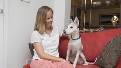 Tina-Maija Bergman and Zoila, the rescued dog that had to be shaved because of neglect. Antonie Robertson / The National