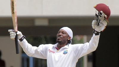 Chris Gayle celebrates his hundred for the West Indies.