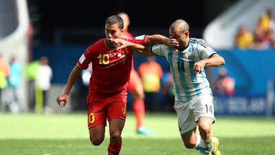 Eden Hazard of Belgium holds off the challenge of Javier Mascherano of Argentina during their match on Saturday at the 2014 World Cup in Brasilia, Brazil. Julian Finney / Getty Images