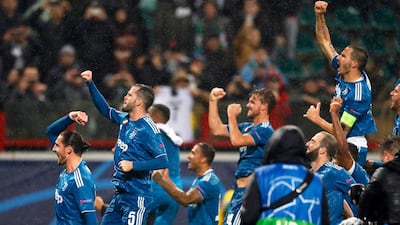 Juventus players join the fun after their late winner against Lokomotiv Moscow. EPA