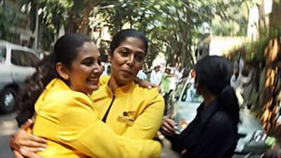 Reinstated Jet Airways employees celebrate in Mumbai after India's biggest private airline announced it had dropped plans to sack hundreds of staff following angry protests.