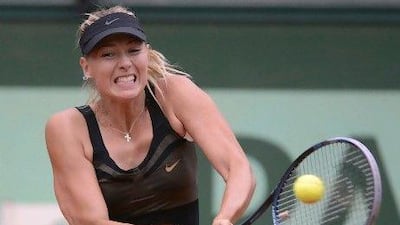 Russia's Maria Sharapova hits a return to Japan's Ayumi Morita.