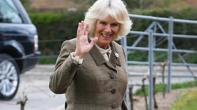 The queen consort wearing a tweed coat and black boots for an official visit to the new Wine Research Centre at Plumpton College on March 26, 2014. Getty Images