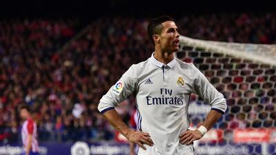 Real Madrid forward Cristiano Ronaldo celebrates after scoring his third goal. Gerard Julien / AFP