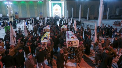 Iraqis attend the funeral of the Kataib Hezbollah members in Najaf, Iraq, on November 22, after US air strikes. AP