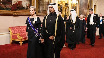 Britain's Sophie, Duchess of Edinburgh, left, and Qatari Energy Minister Saad Sherida Al Kaabi, right, arrive at Buckingham Palace. AFP