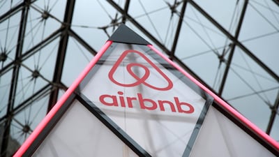 The Airbnb logo under the glass Pyramid of the Louvre museum in Paris, France. Reuters