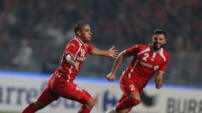 Tunisia's Wahbi Khazri, left, celebrates a goal against Algeria in a friendly on Sunday ahead of the 2015 Africa Cup of Nations beginning January 17. Mohamed Messara / EPA / January 11, 2015