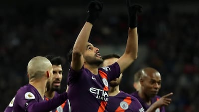 Riyad Mahrez of Manchester City gestures to the sky after scoring the game's only goal. Getty Images