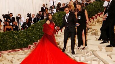NICKI MINAJ, MAY 2018: Another look for the Met Gala, which really is the Super Bowl of dramatic dressing, this Oscar de la Renta is a red river of tulle. We love how it is ombre, from the oxblood shrug to the scarlet red train. EPA