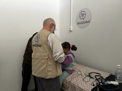 Dr John Kahler sees a patient in Gaza in January 2024. Photo: MedGlobal