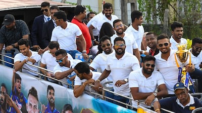 Sri Lankan players during an open-top bus parade in Colombo. AFP