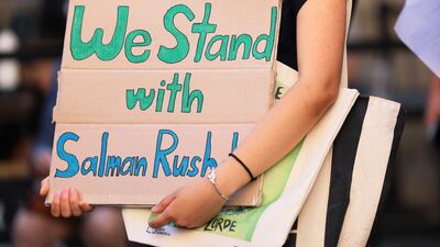 Supporters carry home-made signs. Getty Images / AFP