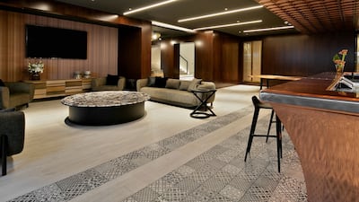 The property's expansive basement, complete with a bar and TV area.