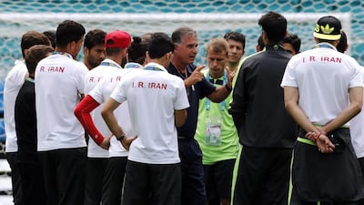 Iran coach Carlos Queiroz, centre, is one of nine foreign managers who will feature in the upcoming 2015 Asian Cup.