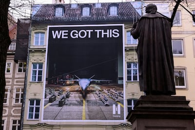 An ad for Munich defence company Helsing is displayed at the conference. A poll shows there is a growing sense that a world war is imminent. Reuters