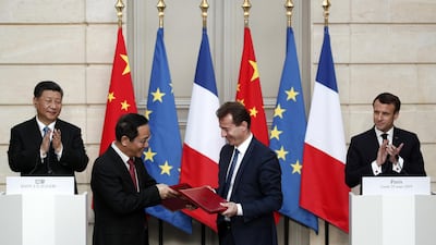 French President Emmanuel Macron and Chinese President Xi Jinping applaud as President of Airbus, Guillaume Faury and Chairman of China Aviation Supplies Company, Jia Baojun, shake hands at the signing ceremony. Reuters