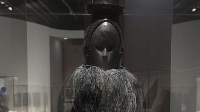 'Mask from Sierra Leone', wood with a modern raffia fringe, late 1880s CE, Sierra Leone. Mona Al-Marzooqi / The National