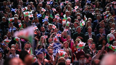 Delegates fly flags as UK Prime Minister Keir Starmer delivers his keynote address on the third day of the annual Labour Party conference in Liverpool in September. AFP