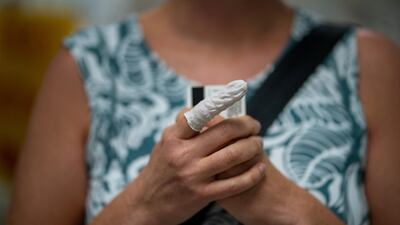 First-time voter Vanessa Sinnott, who became an American citizen three years ago, waits in line at City Hall to cast her ballot for the upcoming presidential election as early voting begins in New Orleans, Louisiana, USA. Reuters