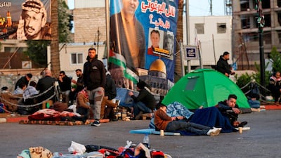 People camp overnight during a protest against a social security law proposed by the Palestinian Authority in Ramallah, West Bank. AFP