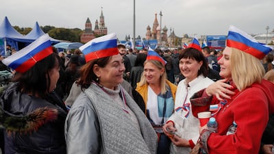 Russians gather for a celebration after the ceremony in central Moscow. EPA