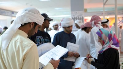 Emirati students looking for jobs at a career fair. Paulo Vecina / The National