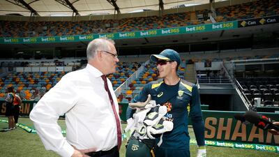 Australia Prime Minister Scott Morrison speaks with Tim Paine. Getty