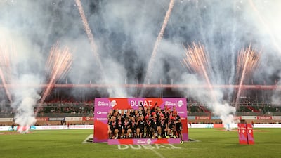 New Zealand players celebrate victory at The Sevens in Dubai