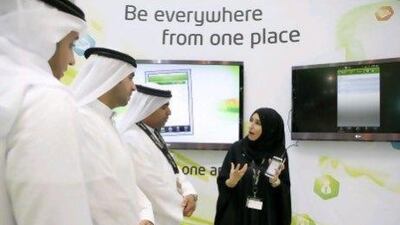 Maha Muraish, the director of online channels and portals at Etisalat, explains the ePlus app at Gitex. Antonie Robertson/The National