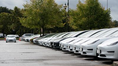 Tesla electric cars at a delivery site in Manchester, England in September. AP
