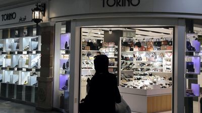 People wearing protective face masks a at the Al Naeem City Center in Ras Al Khaimah. UAE government lift the coronavirus restriction for the residents around the country. Pawan Singh / The National