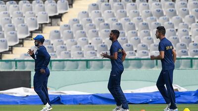 Sri Lanka players warm up in Mohali. AFP