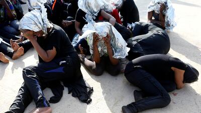 Migrants at a naval base after being rescued by Libyan coast guards in Tripoli in June 2018. Reuters
