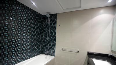 The bathroom of an apartment at the Cayan Tower. Razan Alzayani / The National