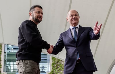 German Chancellor Olaf Scholz and President Zelenskyy shake hands during an official welcome ceremony on Sunday at the Chancellery in Berlin. AFP