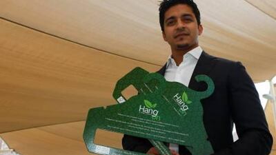 Asim Amin Nalkhande shows off eco-friendly paper hangers. He plans to distribute two million across Abu Dhabi and Dubai each month.