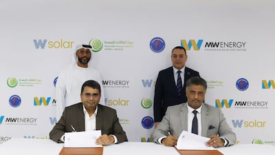 W Solar and Gecol executives at the signing ceremony. Photo: Alpha Dhabi